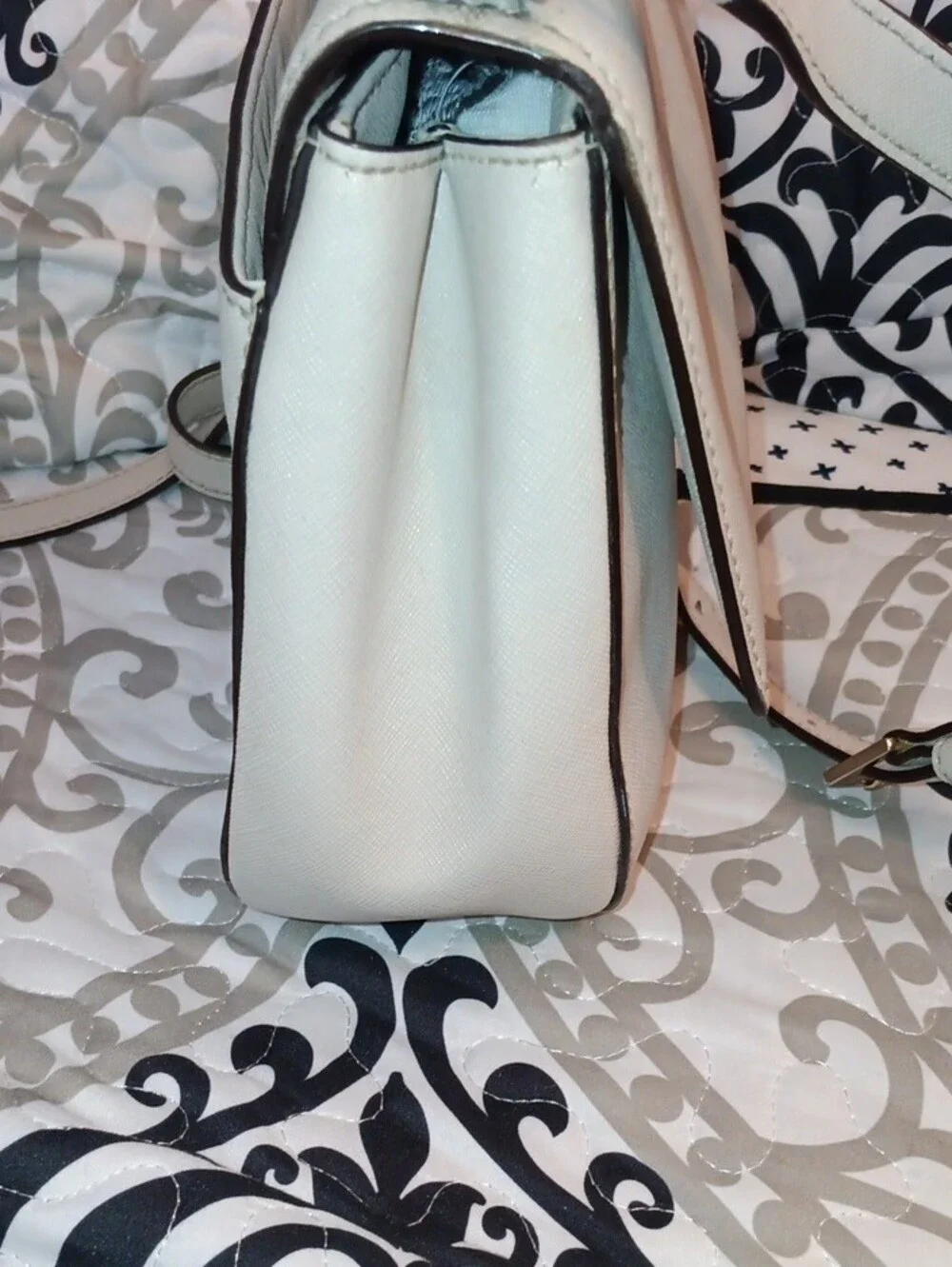 kate spade cream saddle crossbody with gold-tone logo